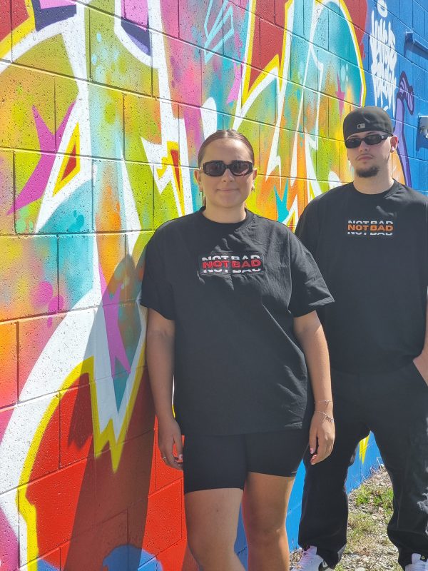 male and female models using not bad clothing Oversized TEE red and orange